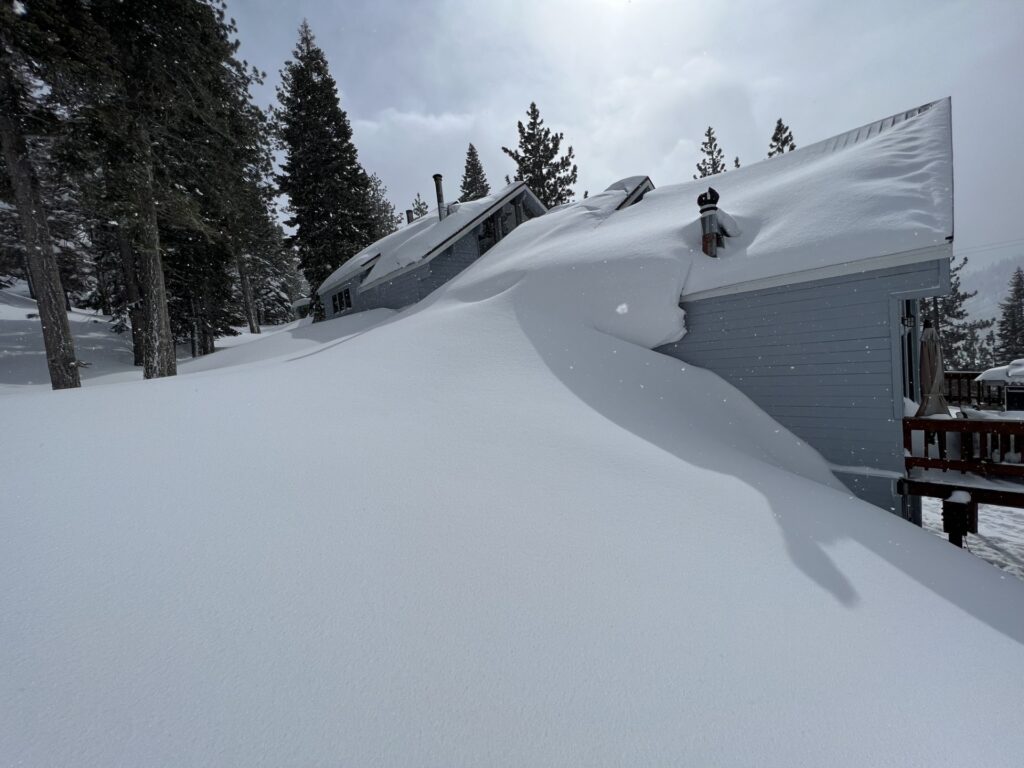 Deep Sierra snow surrounding a mountain home near Truckee, California