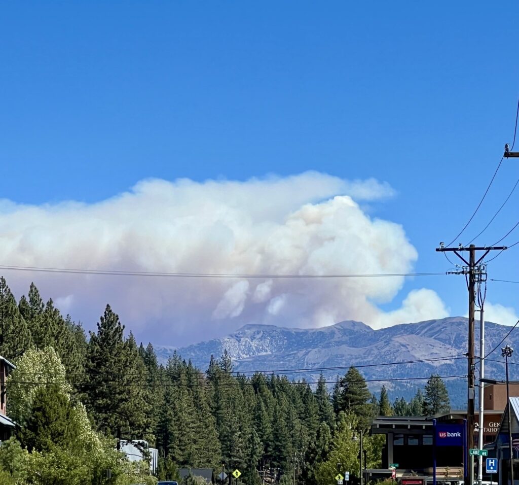 Wildfire smoke rising behind the Sierra near Truckee, California